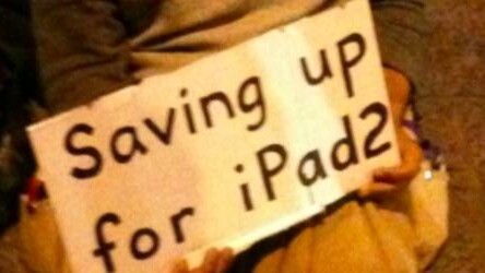 Man panhandling for an iPad 2 at SXSW. What’s the world coming to?