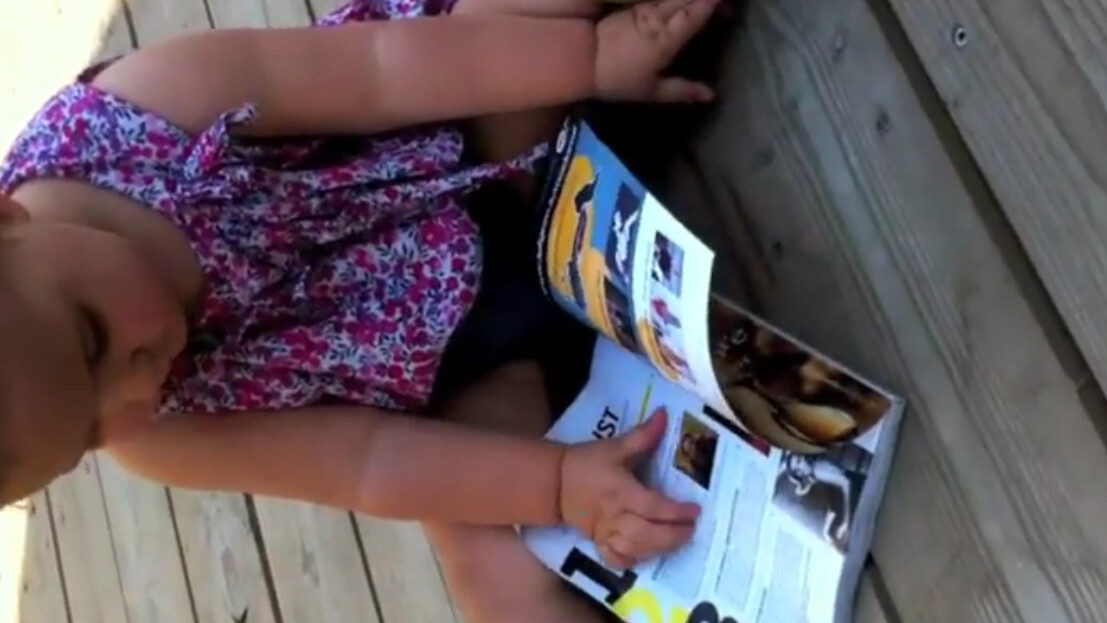 This baby tried to use a glossy magazine like an iPad, and failed
