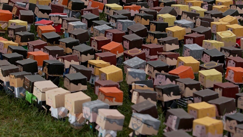 Thousands of tiny cardboard people stage a ‘protest’ outside the Houses of Parliament in London