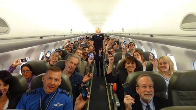 Good times. A photo of happy passengers from the first flight to allow gate-to-gate gadget use