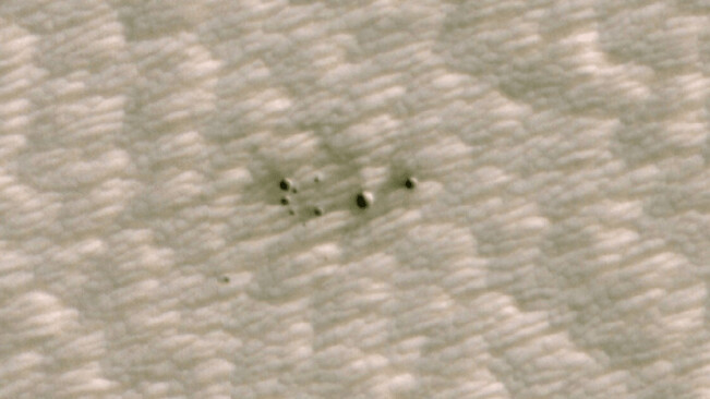 NASA releases images of the first craters on Mars discovered by AI